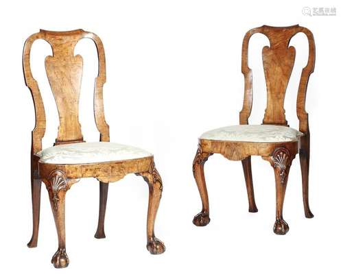 A pair of George II walnut side chairs, each with …