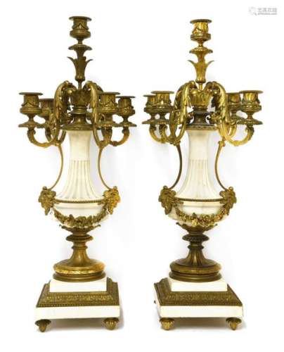 A pair of gilt bronze and white marble five branch…