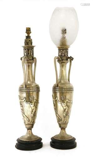 A pair of silver plated oil lamps 19th century, of…