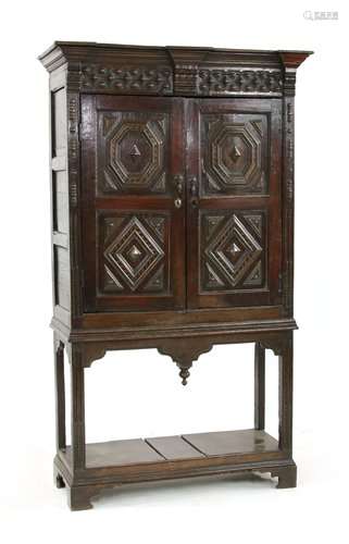 An oak and inlaid cupboard on stand, late 17th cen…