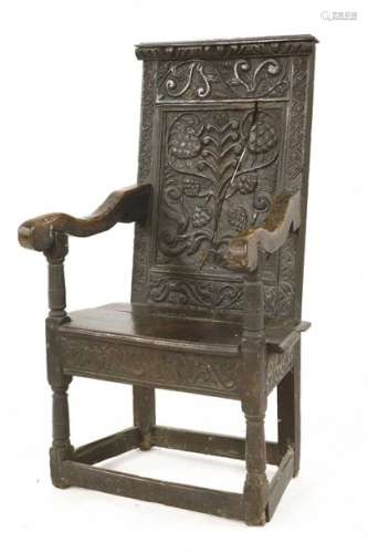 An oak armchair, 17th century and later, with a ca…