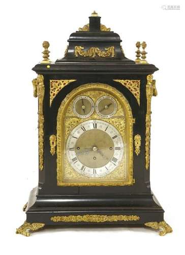 An ebonised musical bracket clock, the brass arche…