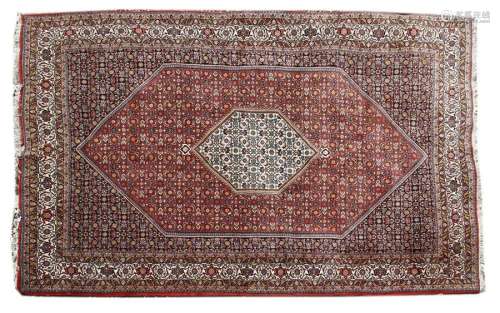 A South West Persian red and navy ground rug 20th …
