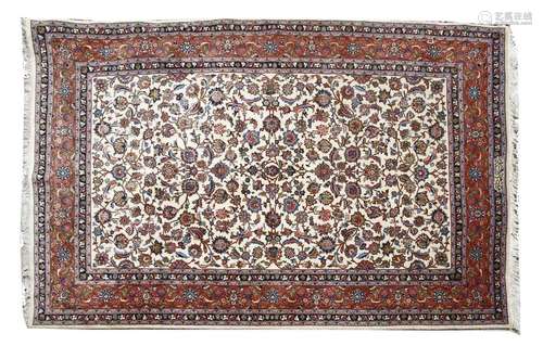 A Persian cream ground carpet, 20th century, with …