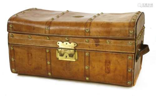 A leather and brass studded trunk, late 19th centu…