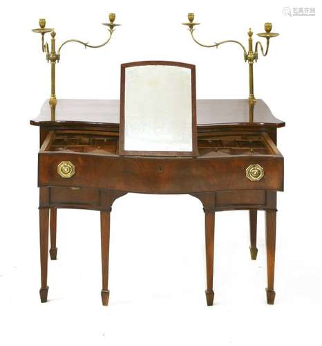 A George III mahogany serpentine dressing table, t…