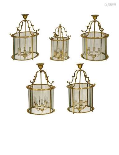 A set of four George III style brass hall lanterns…