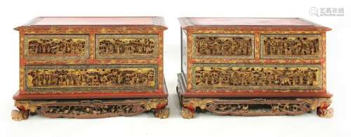 A pair of Chinese red lacquered and gilt low chest…