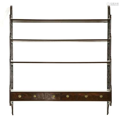 A George III mahogany four tier open wall shelf, w…