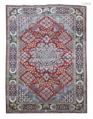 A Persian red ground carpet, 20th century, with a …