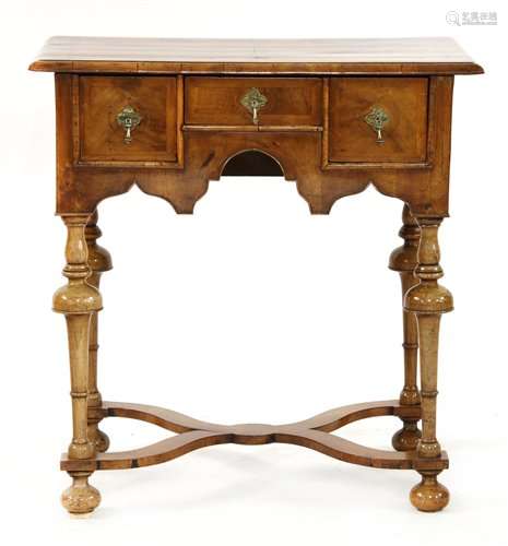 A walnut lowboy, late 17th century and later, with…