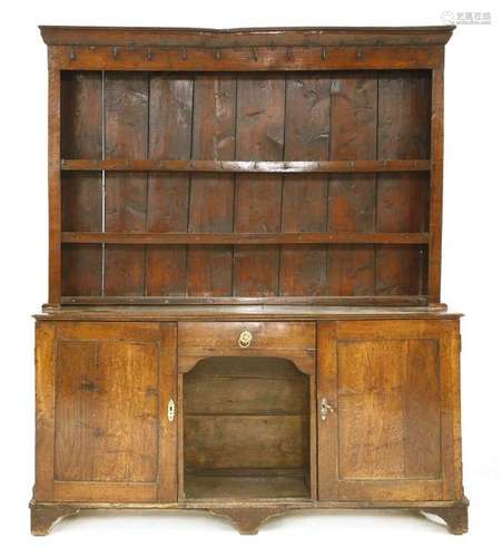 An oak dresser, 18th century and later, the plate …