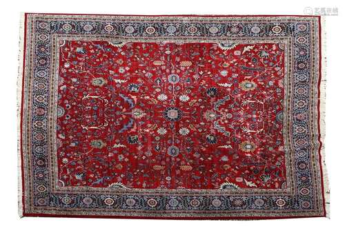 A red ground woollen Kadjar carpet, with scrolling…