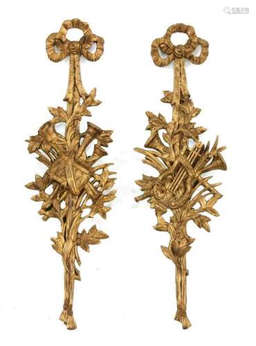 A pair of composite gilt appliqués, each formed as…