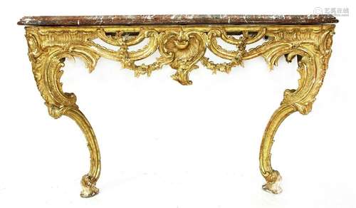 A carved giltwood and marble topped console table,…