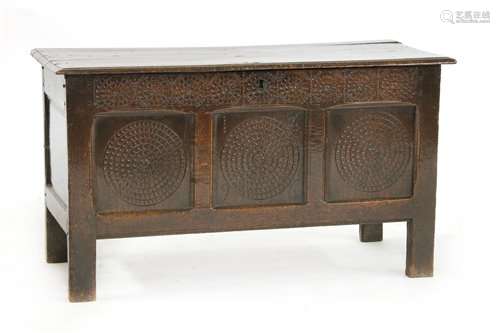 An oak coffer, 17th century, the triple panelled f…