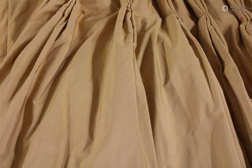 A pair of lined and interlined gold silk curtains,…