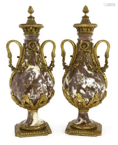 A pair of rouge marble and ormolu mounted urns , l…