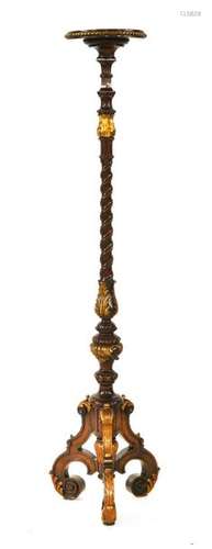 A carved walnut and parcel gilt torchère, with an …