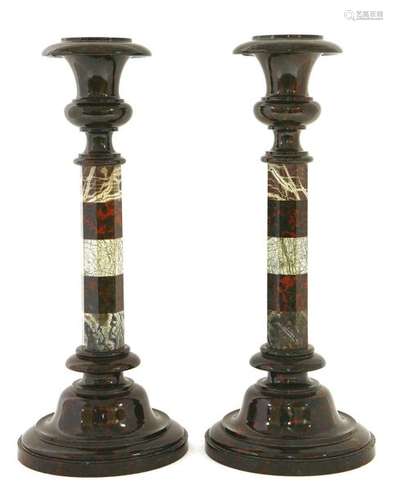 A pair of serpentine candlesticks, each of banded …