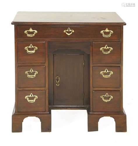 A George III mahogany kneehole desk, seven drawers…