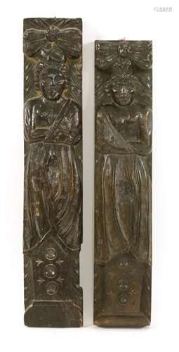 A pair of carved oak term figures, 18th century, e…