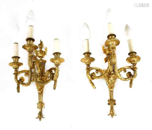 A pair of gilt brass three branch wall lights, 20t…