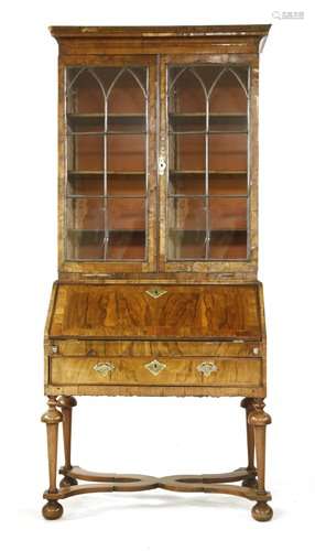 A walnut bureau bookcase, 18th century and later, …