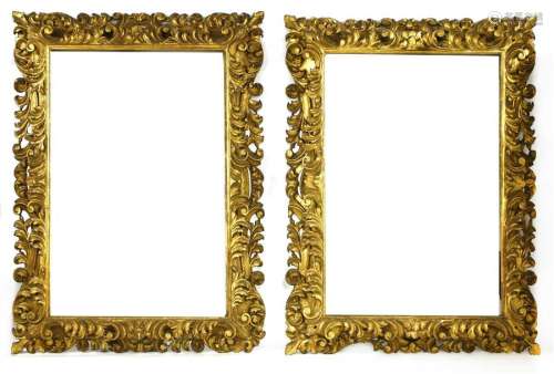 A pair of large carved giltwood frames, each of do…