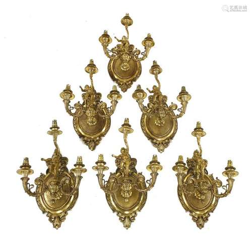 Six three branch gilt metal wall lights, the backs…