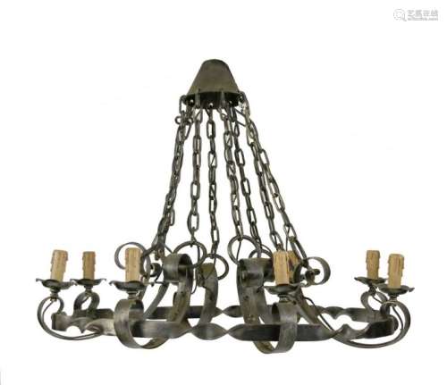A pair of wrought iron strapwork eight light elect…