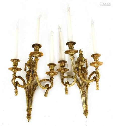 A pair of gilt brass three branch wall lights, eac…