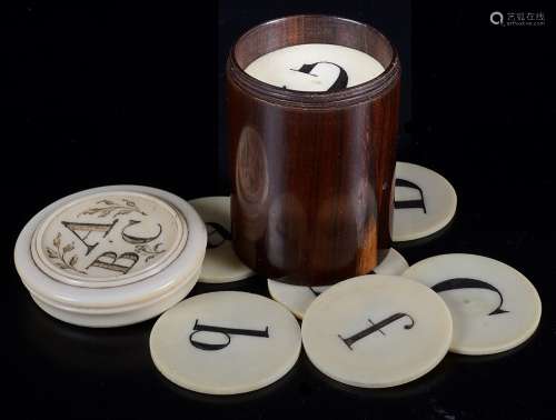 A Collection of 19th Century Ivory Alphabetic Counters: Roundels of ivory carved with Arabic
