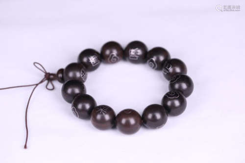 A CHENXIANG WOOD BRACELET EMBEDED SILVER