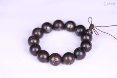 A CHENXIANG WOOD BRACELET EMBEDED SILVER