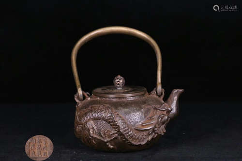 A IRON CASTED DRAGON PATTERN POT