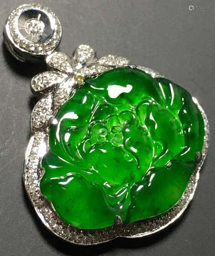 A GREEN JADEITE CARVED PEONY PENDANT, TYPE A