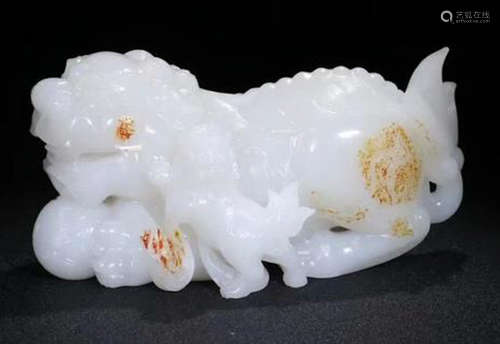 A HETIAN SUET JADE CARVED LION SHAPED PENDANT