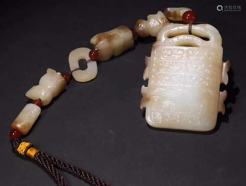 A HETIAN JADE CARVED AUSPICIOUS PATTERN PENDANT