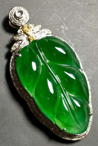 A GREEN JADEITE CARVED LEAF PENDANT, TYPE A