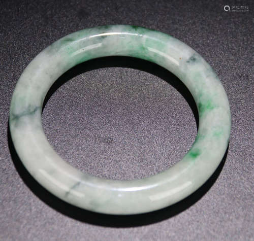 A JADEITE CARVED SIMPLE BANGLE