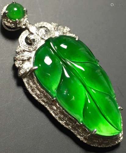 A GREEN JADEITE CARVED LEAF PENDANT, TYPE A