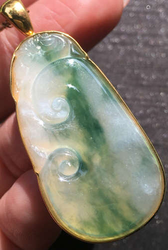 A BLUE JADEITE CARVED PENDANT, TYPE A