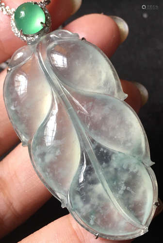 A GREEN JADEITE CARVED LEAF PENDANT, TYPE A