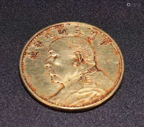 A GOLD CASTED ONE YUAN COIN