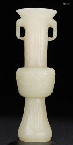 A HETIAN JADE CARVED BEAST PATTERN GU VASE