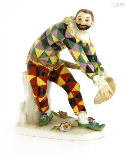 A Meissen figure of a bowing harlequin,