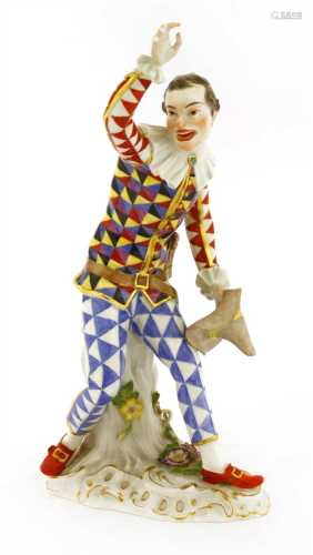 A Meissen figure of an harlequin dancing,