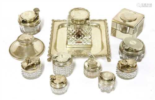 Eleven silver-mounted glass inkwells,