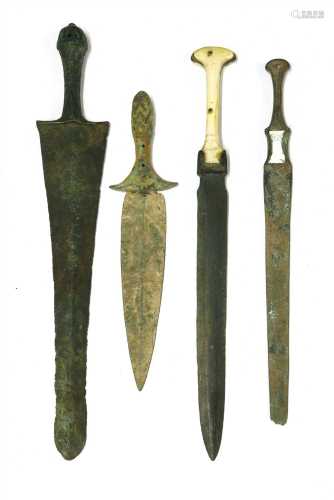 Antiquities: four bronze daggers,